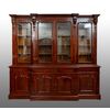 Victorian antique four-door bookcase in flamed mahogany. England, 19th century.