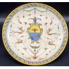 Large majolica parade plate decorated with grotesques, with noble coat of arms – Central Italy