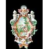 Applique candeliere a due fuochi in maiolica con figure grottesche ai lati e medaglione centrale istoriato.Manifattura Battaglia.Napoli.