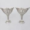 Pair of pierced, embossed and chased silver cups, Hanau, late 19th century