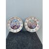 Pair of polychrome &#39;bas-relief&#39; porcelain plates with battle scenes and medallions with male profiles.Ginori.     