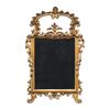 Carved and gilded wooden mirror. Italy, 18th century.