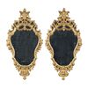 Pair of carved and gilded wooden mirrors. Italy, 18th century.