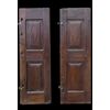 Pair of walnut doors with four engraved diamond panels.