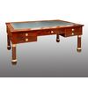 Antique Empire desk in flamed mahogany with gilded bronze inserts. France, early 19th century.