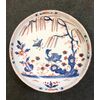Piatto in maiolica a gran fuoco con decoro stile orientale allo’struzzo’.Manifattura di Pasquale Rubati,Milano.