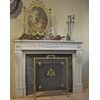 neoclassical fireplace with reducer with sculpted front with subject of acanthus leaf, bow and arrows     