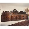 Ravenna, 17th century, Large sideboard with a raised coat of arms painted in walnut.     