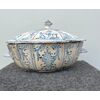 Tureen in majolica with &#39;Rouen&#39; decoration, with stylized vegetal and geometric motifs.Campania.     