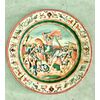 Majolica plate decorated with battle scene in the cavetto and Raphaelesque motifs on the brim. Manufacture of Oreste Ruggeri, Pesaro.     