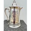 Silver plate chocolate pot with engraved and embossed floral motifs United States.     