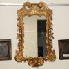 Shaped and carved gilded wooden mirror     