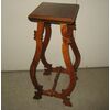 Pot holder in walnut antique lyre feet.     