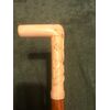 Stick with ivory handle with high relief with plant motifs.     