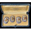Gemelli in argento con scatola originale con decoro a smalto raffigurante teste di cavallo.Italia. 