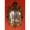 Specchiera in legno dorato ed intagliato
