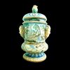 Vaso con coperchio in maiolica con presa a forma vegetale e mascheroni laterali.Decoro istoriato.manifattura G.Cristin,Napoli.