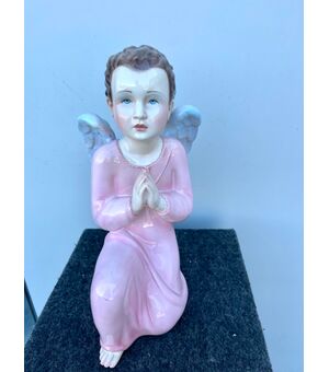 One of a pair of polychrome earthenware angels.Ronzan Manufacture, Turin.     
