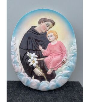 Polychrome earthenware tile with the figure of Saint Anthony of Padua and the Child Jesus Ronzan Manufacture, Turin.     