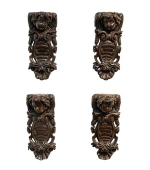 XVII secolo, Quattro fregi con teste di putto e stemmi