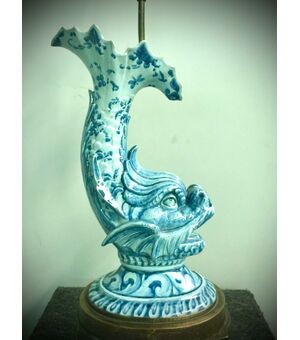 Majolica lamp depicting mythological fish decorated in Savona blue monochrome style.Bronze base.Cantagalli manufacture.Florence.     