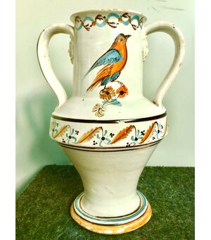 Majolica vase with two masks decorated with stylized floral and plant motifs and bird.Manufactured in Grottaglie or Martina Franca.Puglia.     
