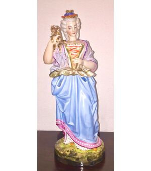 Veilleuse tisaniera figured in polychrome porcelain in the shape of a lady with a dog.Model Jacob Petit.France. 38 cm.     
