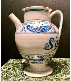 Majolica pourer decorated in blue monochrome with stylized festoons and plant motifs.Manardi Manufacture, Bassano.     