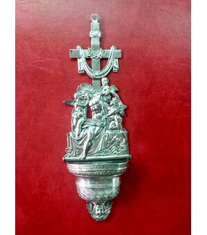 Holy water stoup in embossed silver with a scene of the deposition of Christ with angels.Punzone Lombardo-Veneto.     