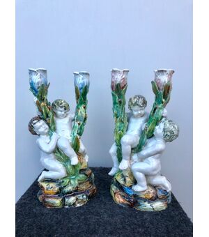 Pair of candlesticks with two burners, with a pair of putti.Minghetti.Bologna manufacture.     