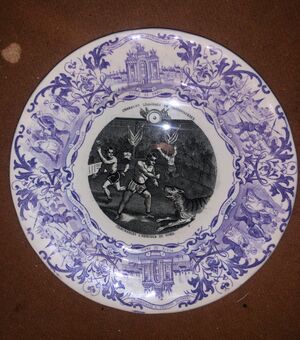 Earthenware plate with decal motif in a circus subject. Sarregumines.Francia     