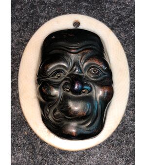 Small mask with grotesque bronze male figure.Japan     