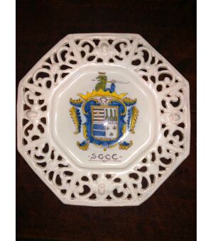 Majolica octagonal cutting board with fretwork and noble coat of arms.     
