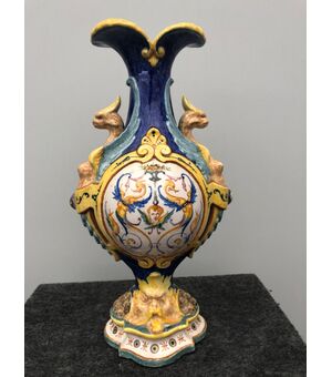 Majolica vase decorated with grotesques with two harpy sockets.Manifattira by Jafet Torelli.Florence.     
