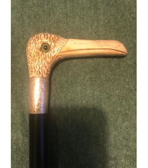 Stick with deer bone handle depicting a bird&#39;s head.     