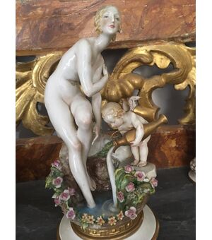 Woman with cupid Capodimonte     