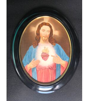 Oval oil painting on canvas depicting the figure of Christ.     