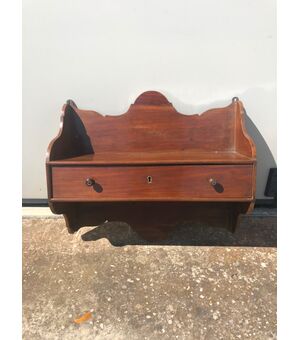 Shelf with a mahogany drawer.     