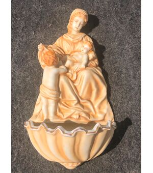 Bisque porcelain stoup with an ocher monochrome figure of Madonna and Child with Saint John. Germany.     