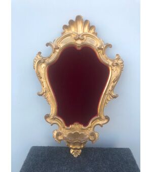 Holy water font frame in gilded and carved wood with rocaille motifs.     