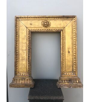 Support frame in carved and gilded wood with geometric motifs.     
