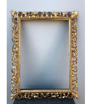Carved wood, perforated and gold leaf foil frame, Florence.     