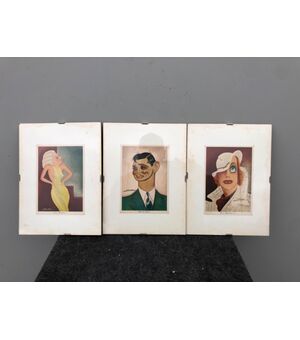 Three postcards framed with caricatures of Nino Za.     