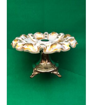 Silver tripod centerpiece stand with layered and ground crystal cup with gold vine branch decorations.     