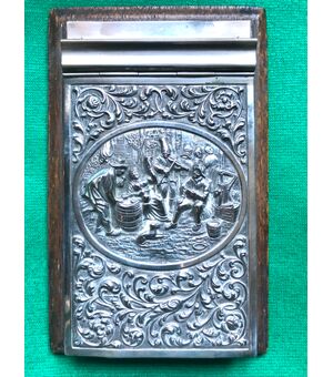 Porta block-notes in legno di palissandro e argento sbalzato con scena paesana e motivi vegetali.Olanda.