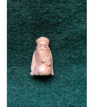 Ivory netsuke &#39;with character sitting with sack in hand. Japan.     