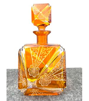 Bottle in layered and ground glass with stylized art deco floral and geometric motifs. Bohemia     