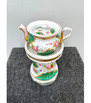 Veilleuse-tisaniera in porcelain decorated with floral and rocaille motifs with gold highlights. France.     