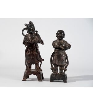 China, Late Ming (17th century), Pair of bronze figures with black patina     