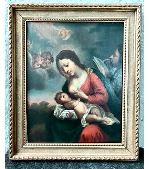 Oil painting on wood with Madonna nursing the Child Jesus Italy.     